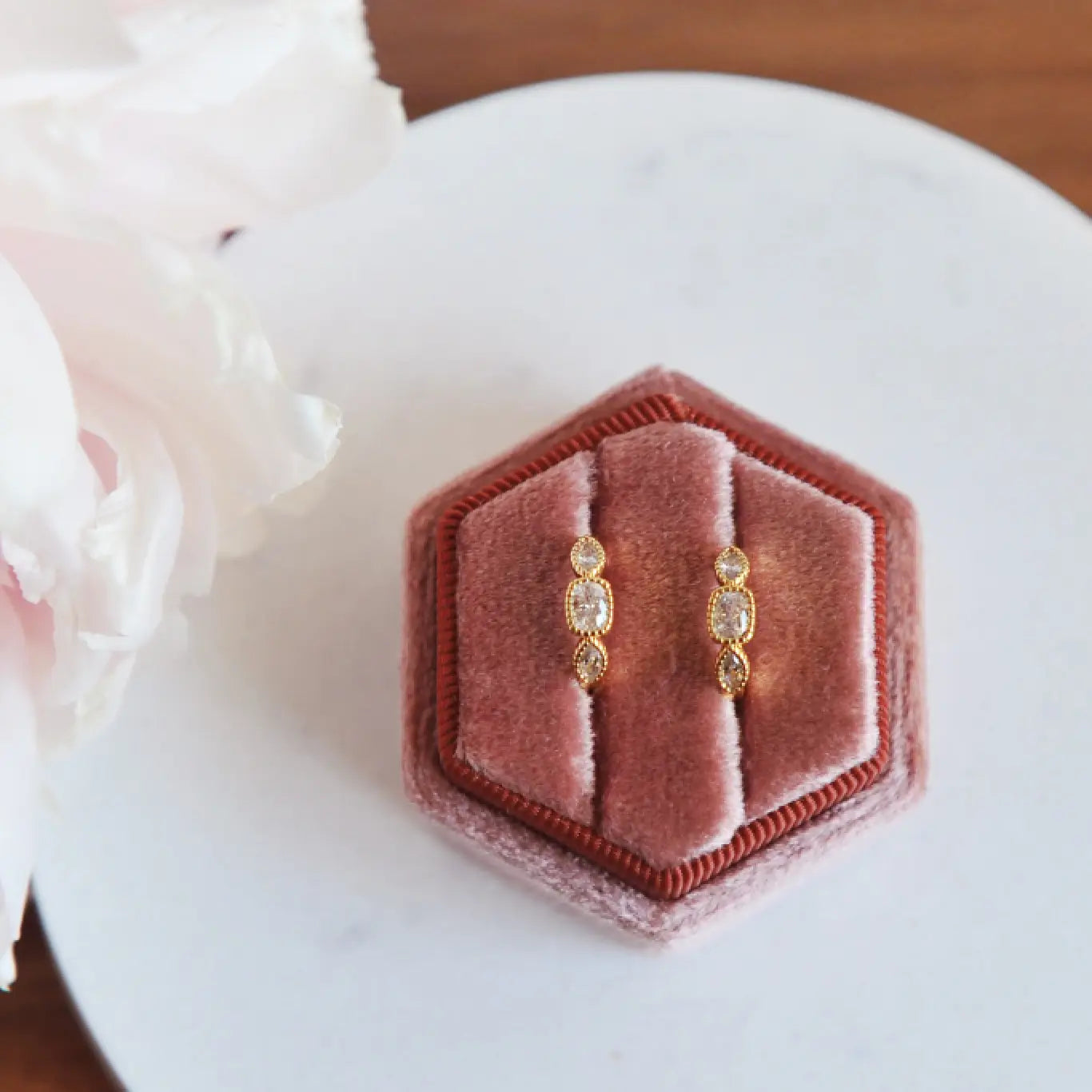 Olivia huggie hoops in a pink ringbox