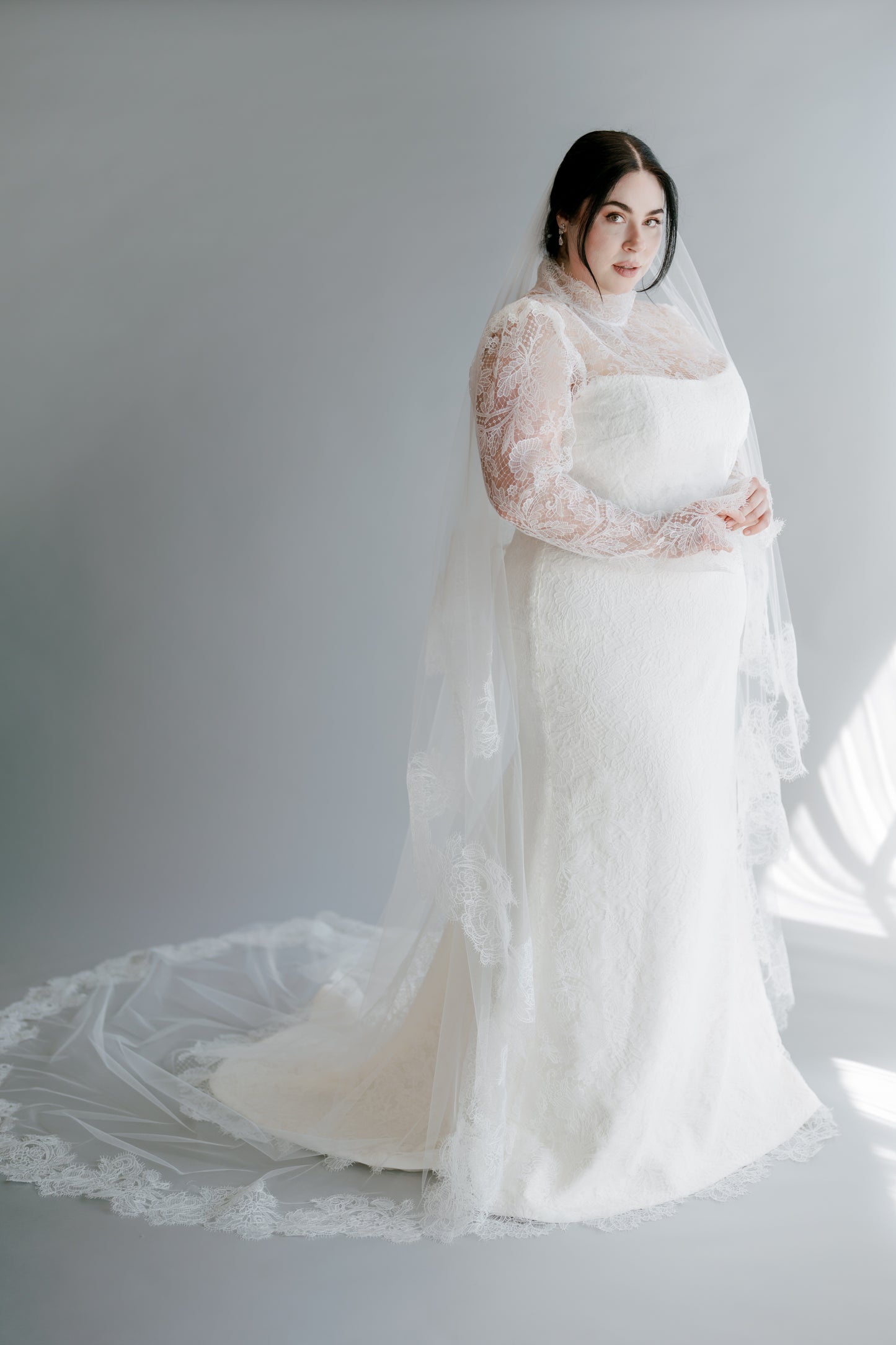 Full body view of Vicki with veil and Gwen topper