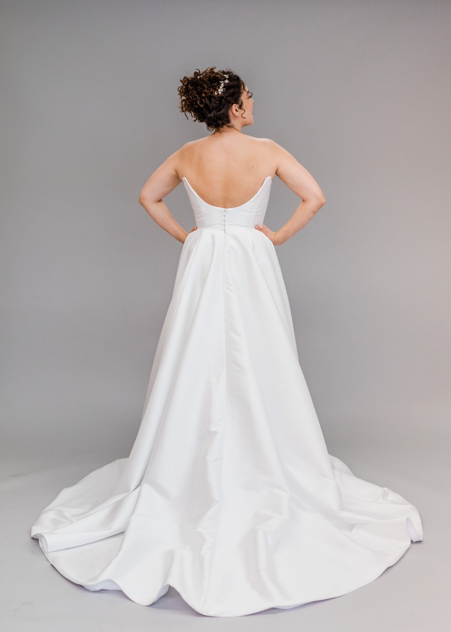 Back View of Poppy/Clara, scooped back mikado wedding dress with detailed buttons
