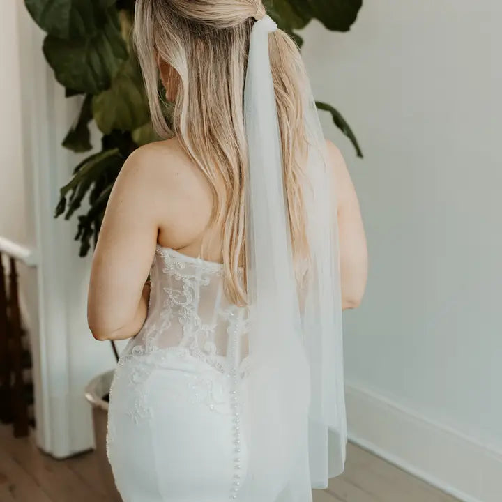 Model in a wedding dress wearing as a hair tie