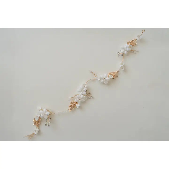 The Eliana hair vine with porcelain flowers, branches in a rose gold