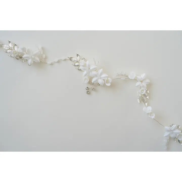 The Eliana hair vine with porcelain flowers, branches in silver.