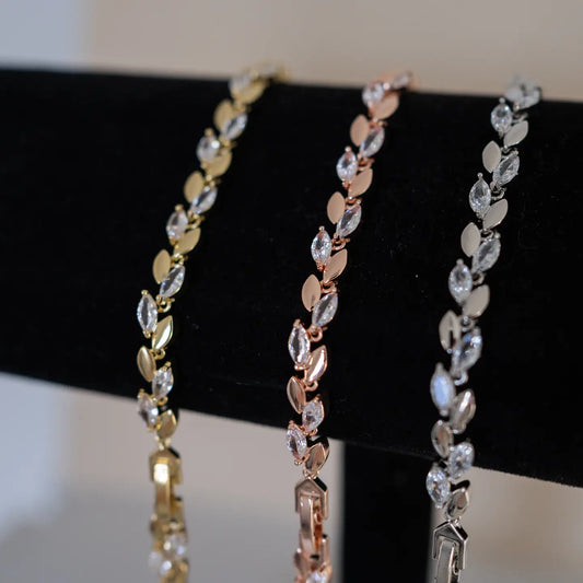 Enhance your bridal ensemble with the Ivy bracelet - an enchanting crystal and metal leaf bridal bracelet.&nbsp;