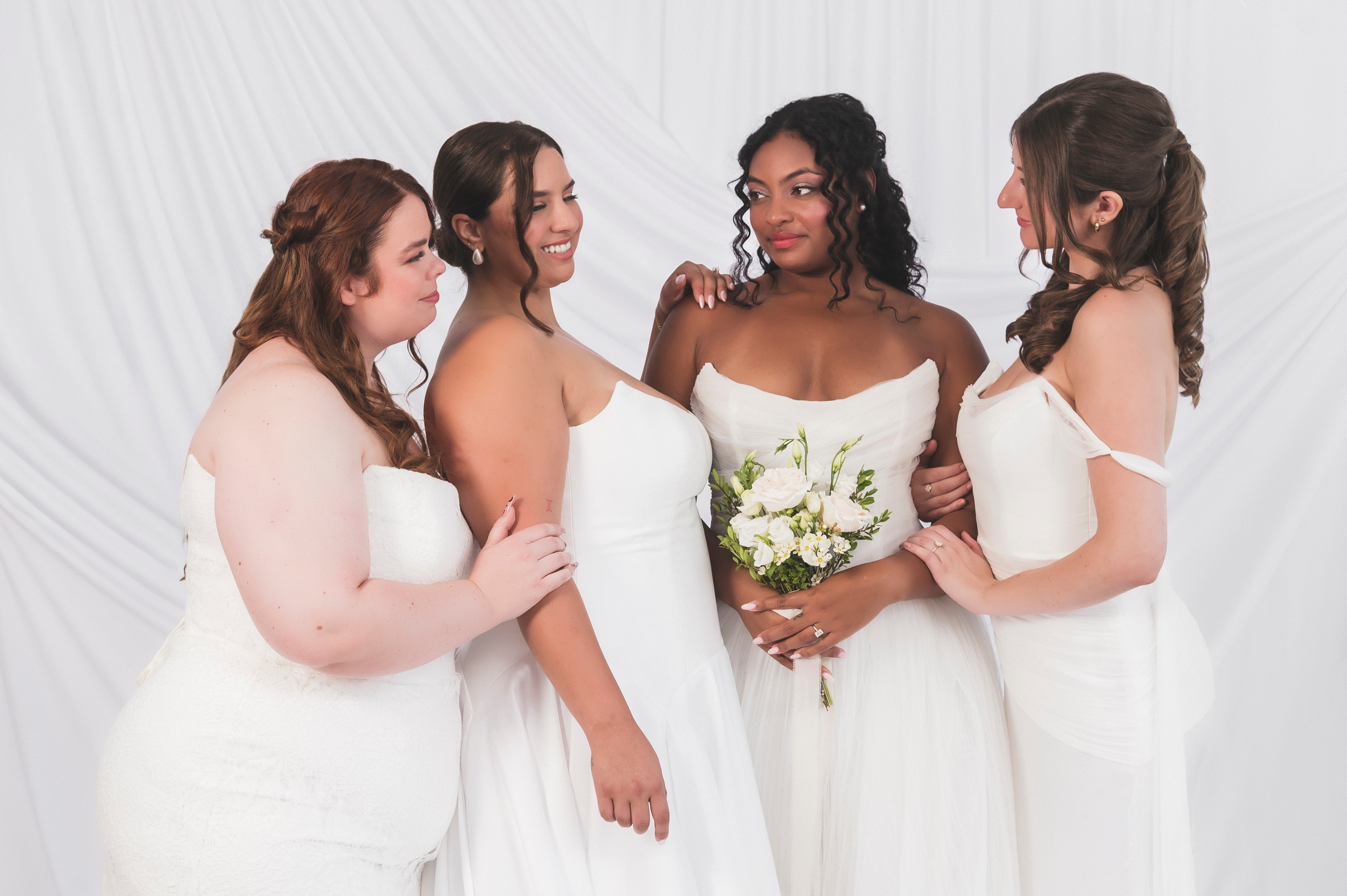 Plus Size Brides alongside other bridal models in a range of Canadian made wedding dresses available at Always Knew Bridal in Ottawa