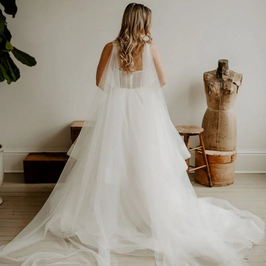 Model wearing angel chapel wings in a neutral background