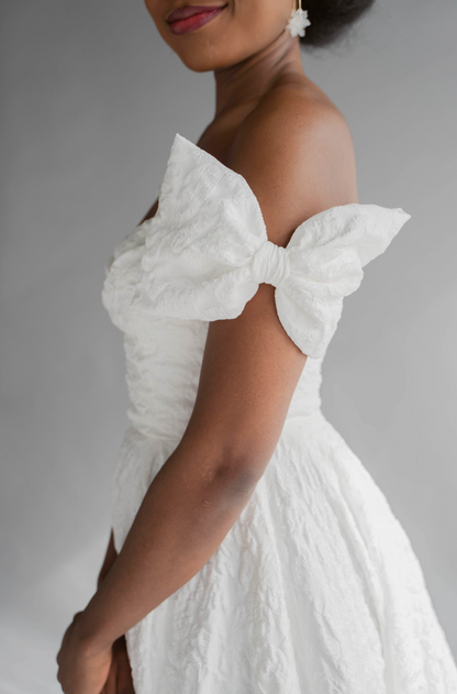 Closeup of the Bow Jacquard Add on to the Lauren textured gown