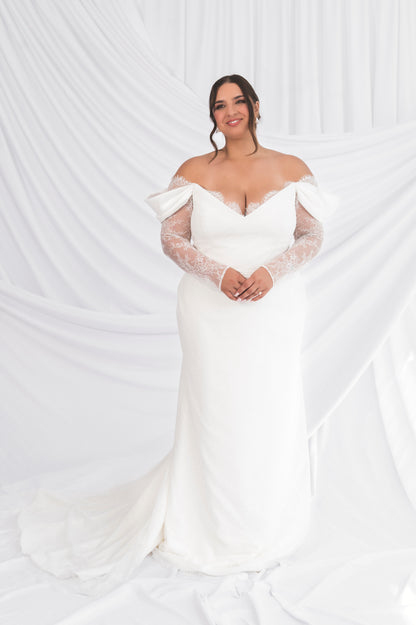 Plus Size Bride in Ottawa, Fitted Column Shift Dress with Eyelash lace, french long sleeves & slight v neck, small traina against a white background