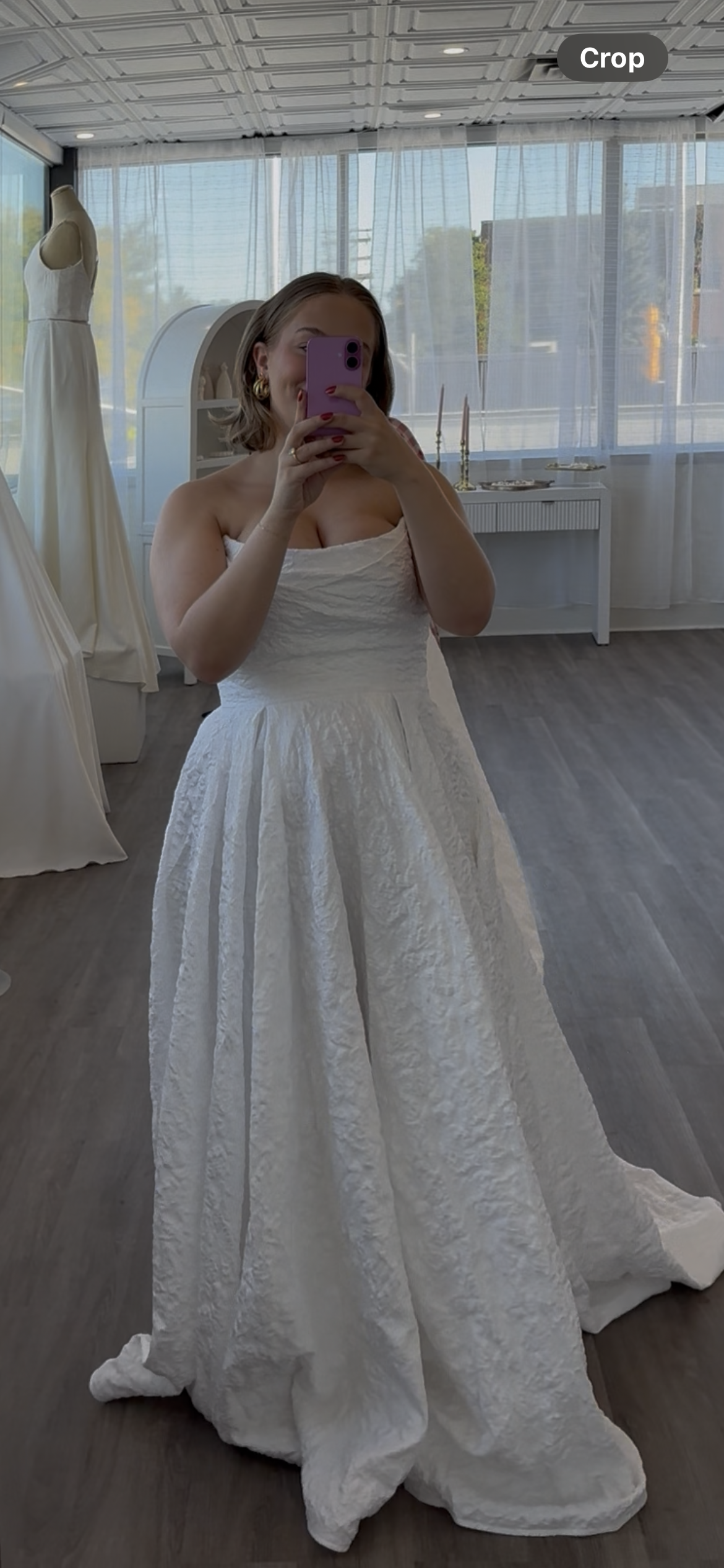 Lizzie wearing scooped neck bridal dress, shown strapless with puffy jacquard