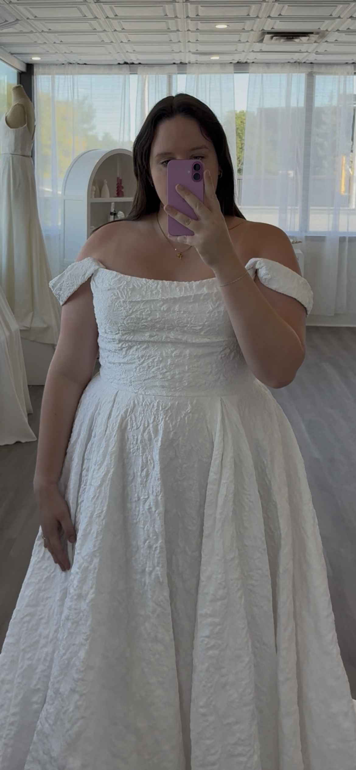 Closeup of the plus size aline with draped sleeves at Always Knew
