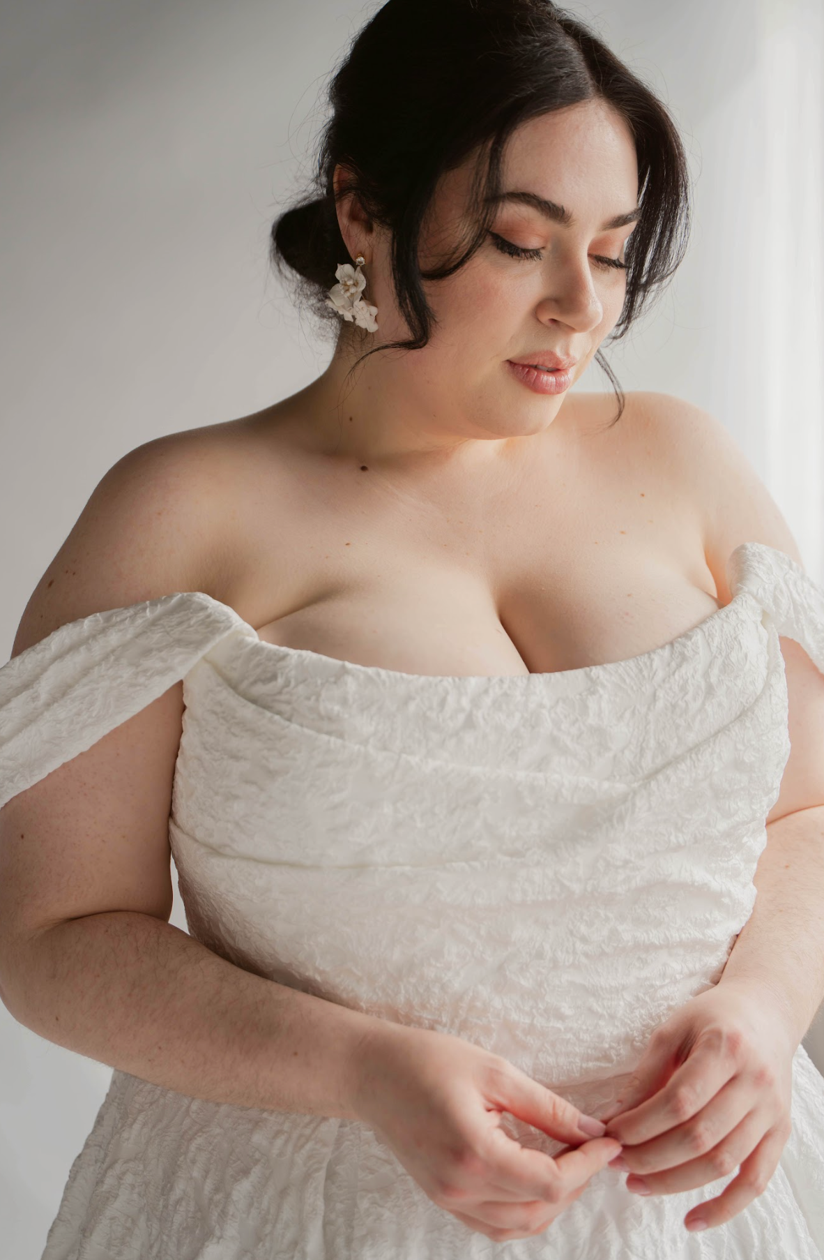 Closeup of Plus Size Wedding Gown Scooped Textured Wedding dress with off the shoulder drapes
