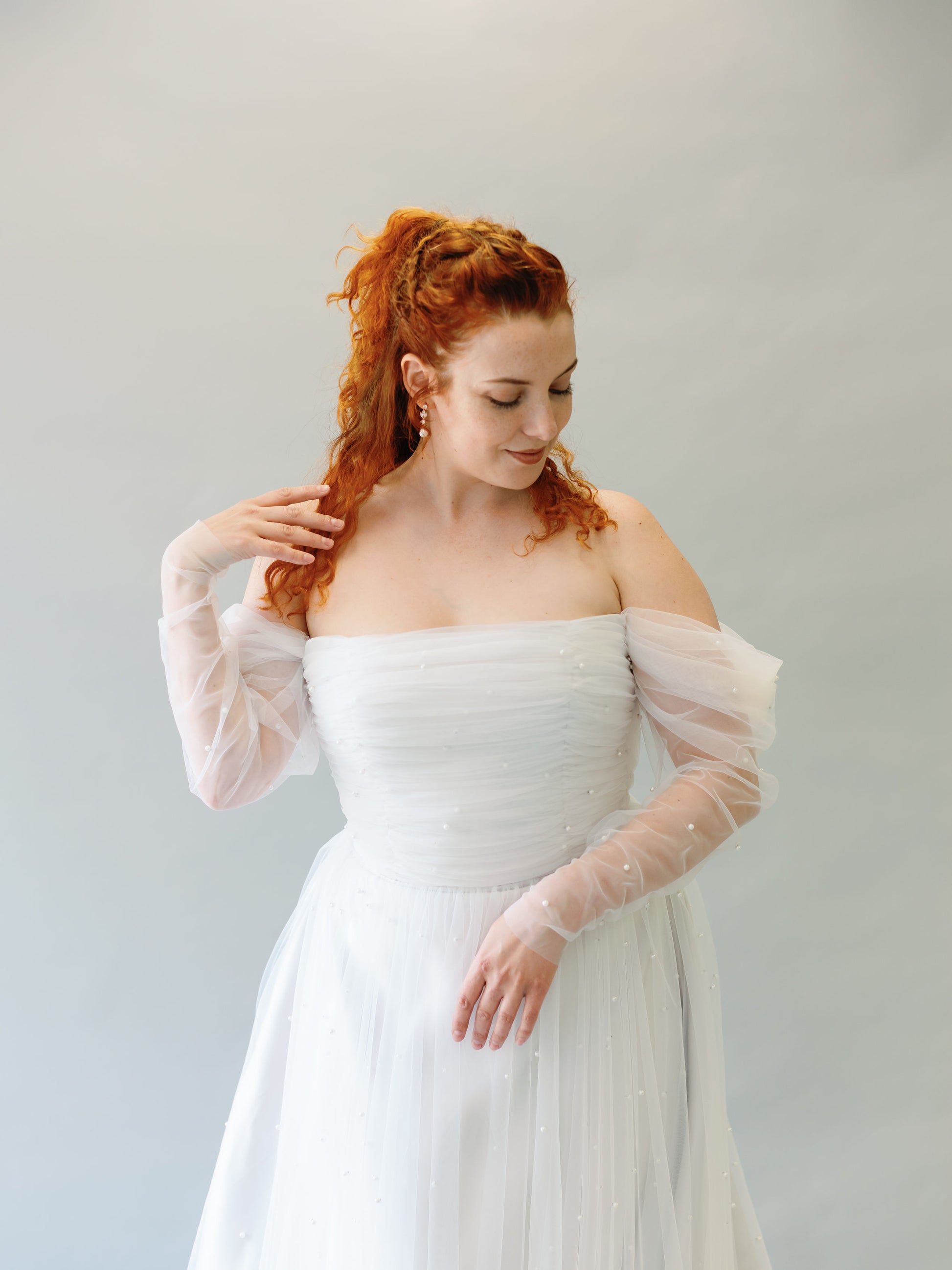 Close up front body view of the Ophelia dress with tulle and pearls