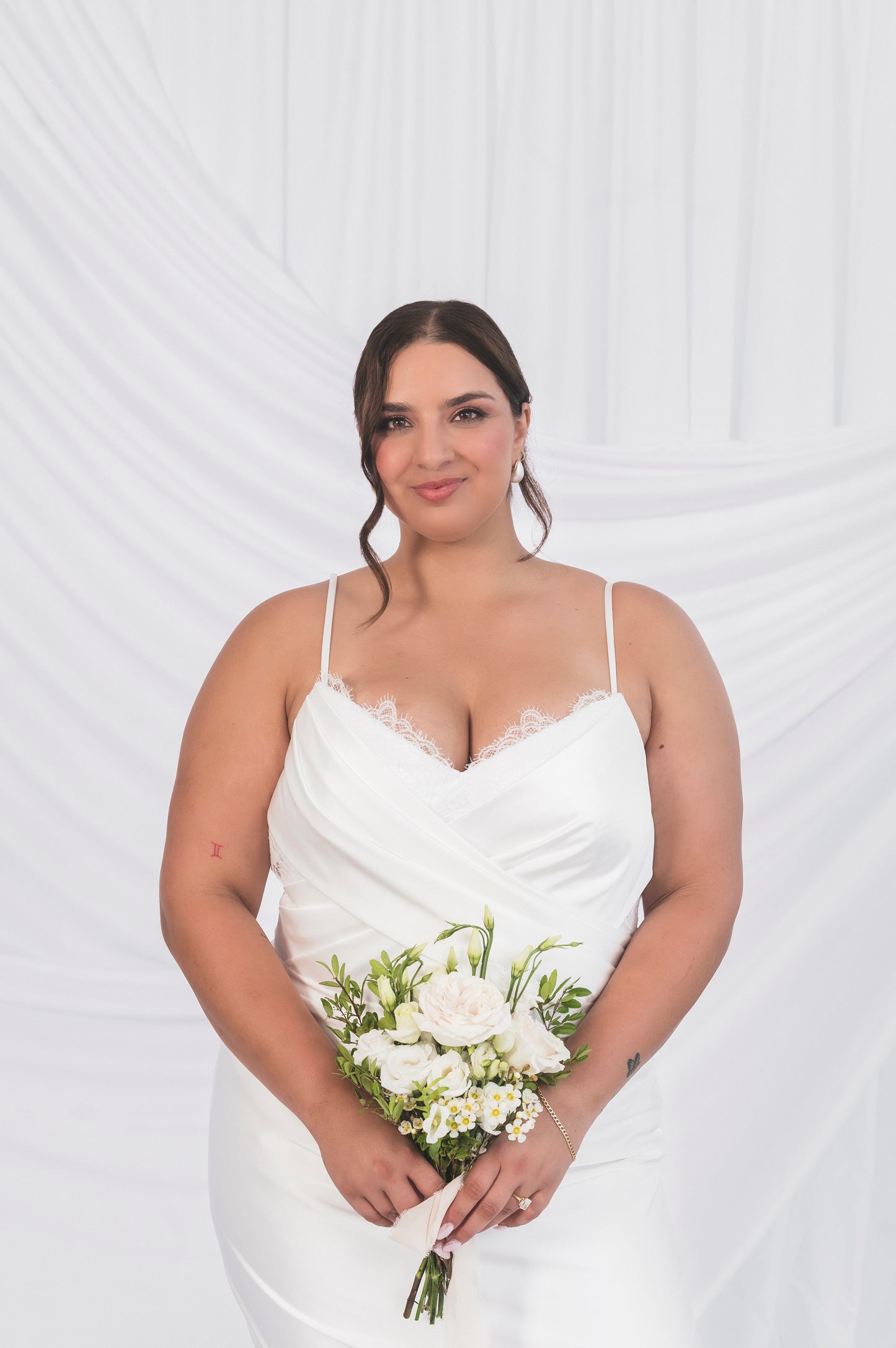 Close view of the italian satin ariel/tessa shift dress with a little bit of lace of bodice. 