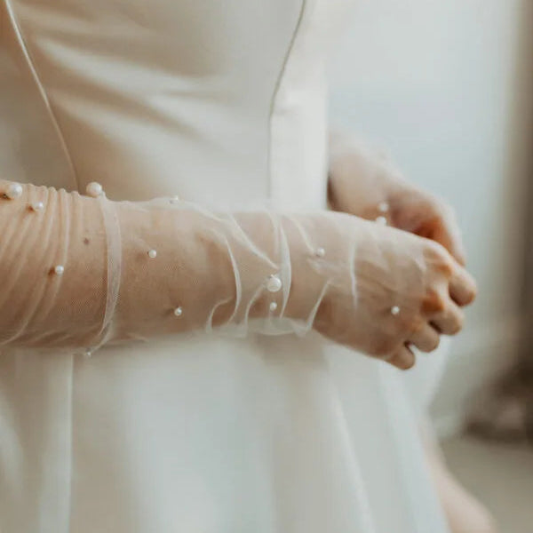 Close up of tulle beaded pearl sleeves