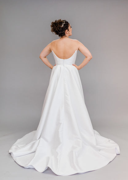 Back View of Poppy/Clara, scooped back mikado wedding dress with detailed buttons 