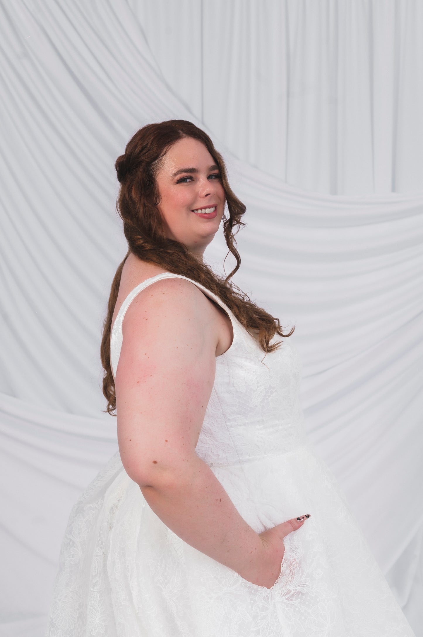 Plus Size Bride in Ottawa wearing the Sierra gown in full lace, which shows off pockets and thick straps