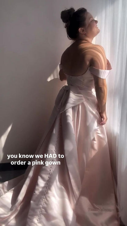 Designer Kathryn Bass, showing off our poppylaura wedding dress with the oversized bow 