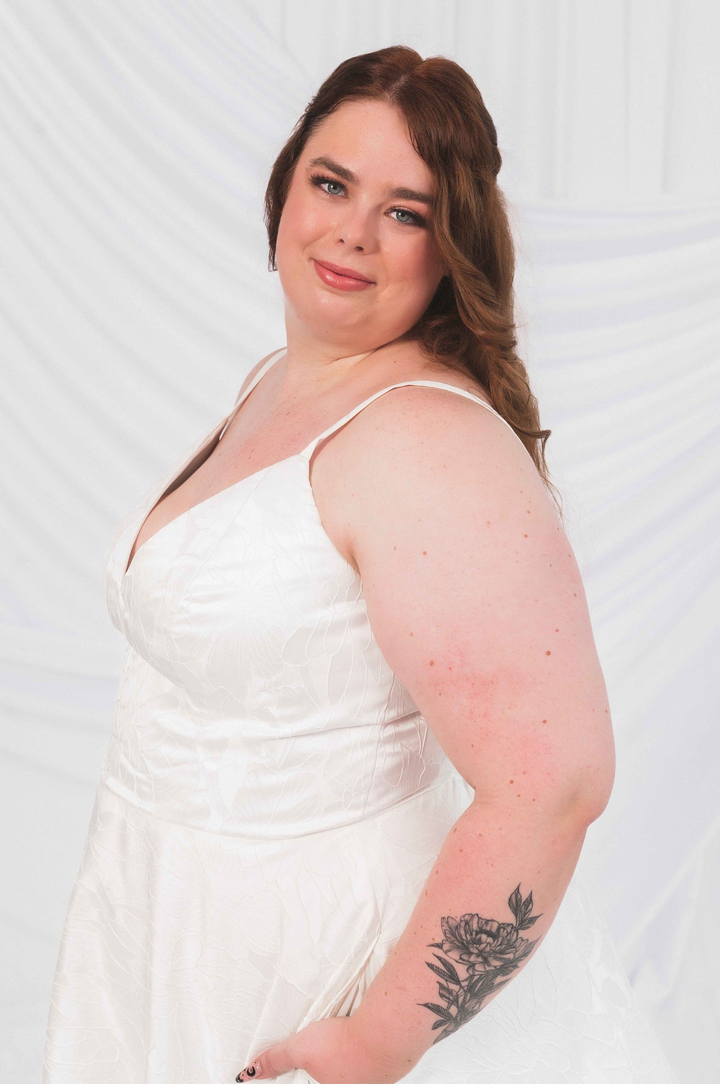Laura/Tasha wedding dress on a plus size bride for wedding dress shopping ottawa. A-line textured wedding dress with v-neck, straps, and wedding gown pockets
