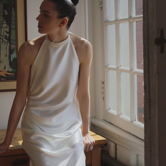 Closeup of the model laurene gown, satin high neck model