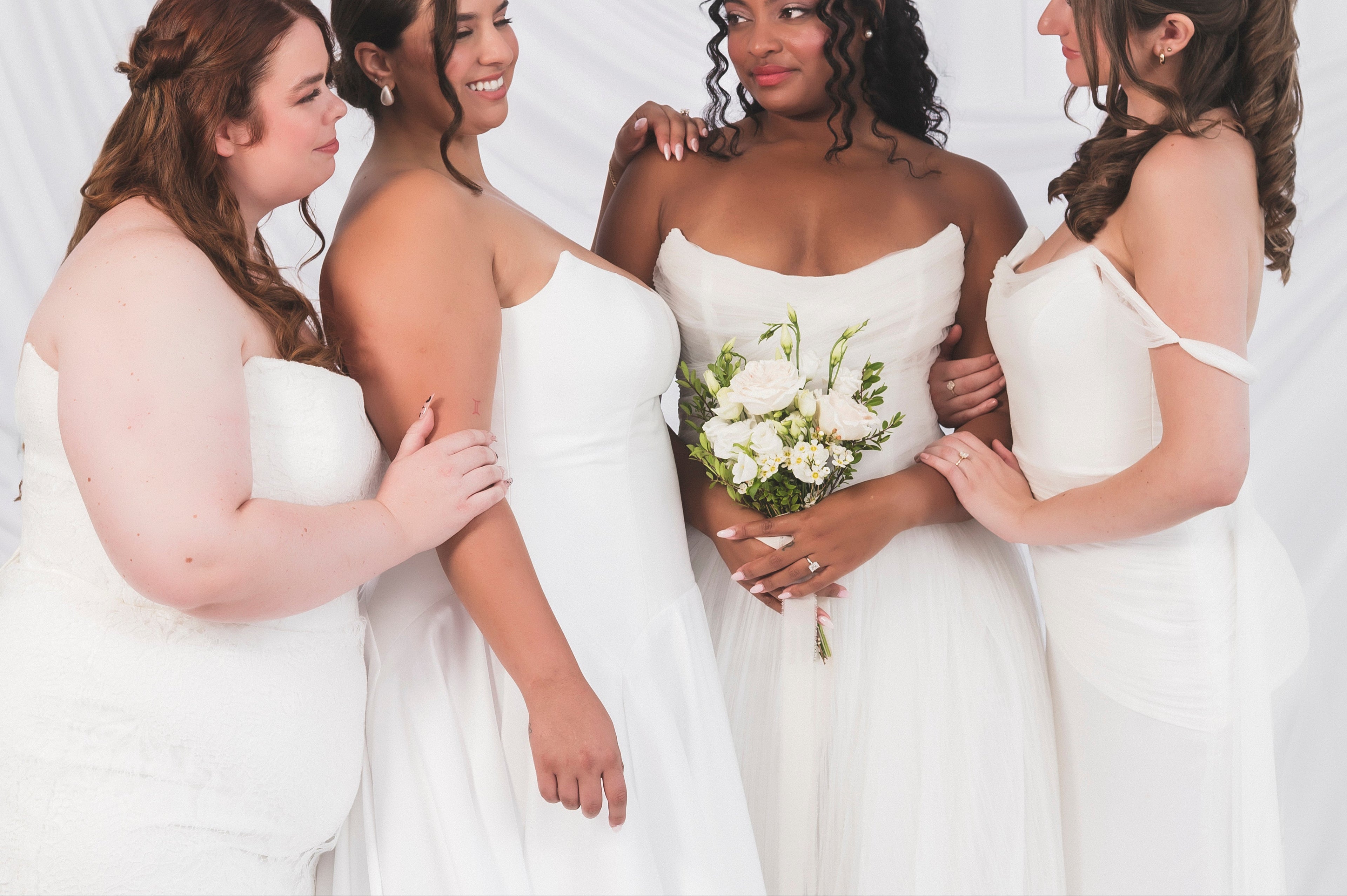 Plus Size Brides alongside other bridal models in a range of Canadian made wedding dress shop available at Always Knew Bridal in Ottawa